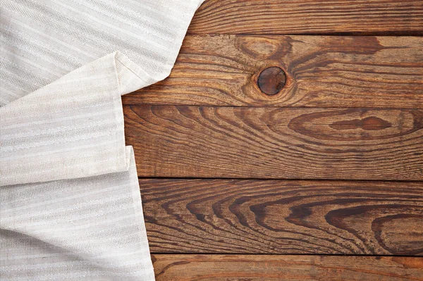 Empty canvas napkin on wooden desk top view — Stock Photo, Image