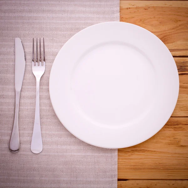 Cutlery red checkered tablecloth tartan on  wooden table top view. — Stock Photo, Image