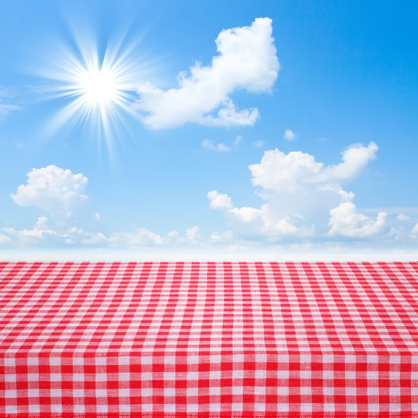 Canvas texture or background on table. Blue sea and clouds sky