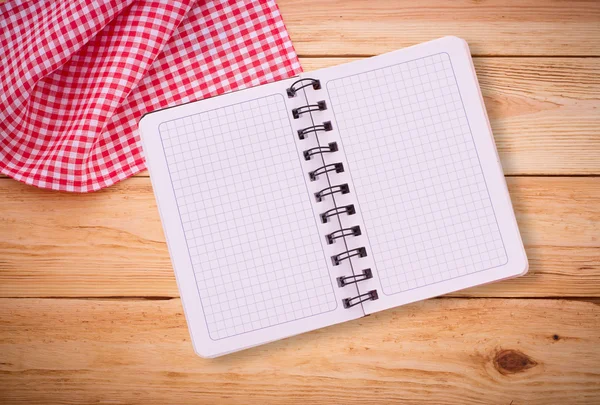 Pure notebook for recording menu, recipe on red checkered tablecloth tartan. — Stock Photo, Image