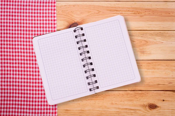 Pure notebook for recording menu, recipe on red checkered tablecloth tartan. — Stock Photo, Image