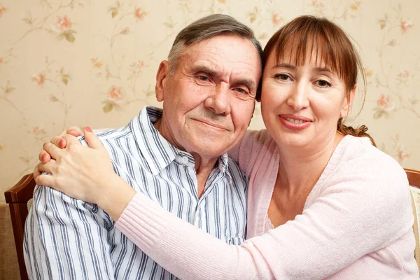 Senior man, woman with their caregiver at home. — Stock Photo, Image