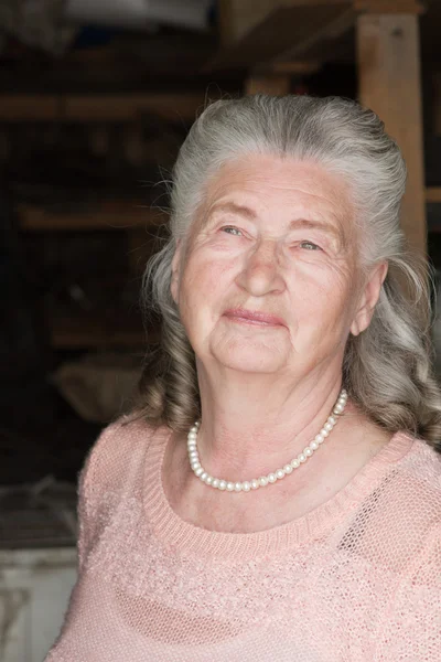 Senior woman walking in countryside spring — Stock Photo, Image