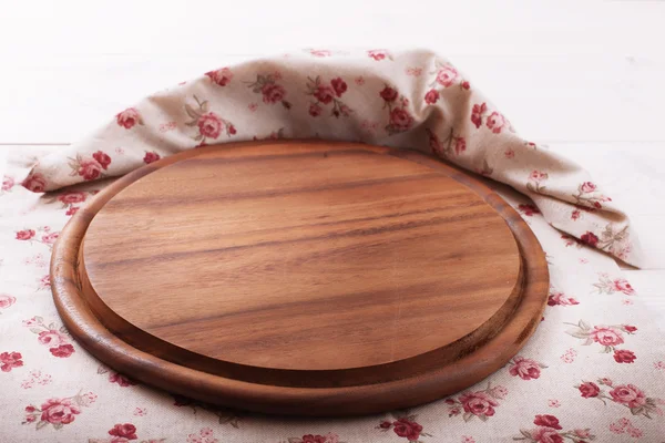 Empty wooden cutting board pizza on tablecloths for menu