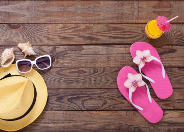 Trendy summer accessories on wooden background pool. clipart