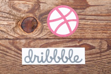 Dribbble logotype printed on paper clipart