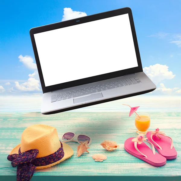 Summer background with necessities and laptop white screen. — Stock Photo, Image