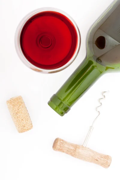 Glass and bottle of red wine. Top view unusually on white background. — Stock Photo, Image