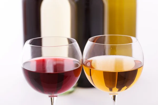 Glasses and bottles of wine unusually on white background. — Stock Photo, Image