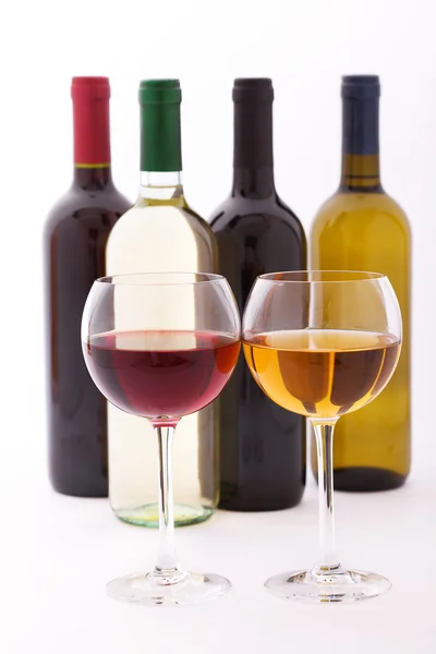 Glasses and bottles of wine unusually on white background. — Stock Photo, Image