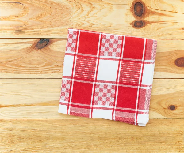 Kitchen. Wooden kitchen table with empty red tablecloth for dinner. — Stock Photo, Image