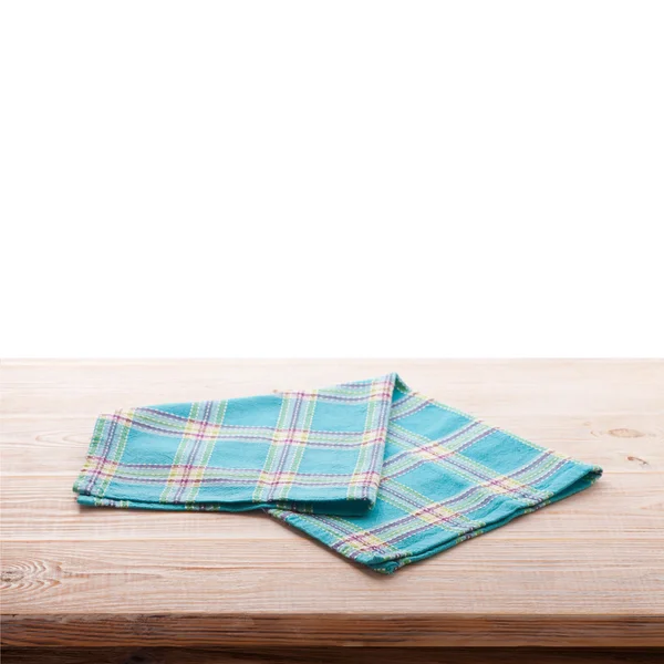 Tablecloth on wooden deck table, white background. — Stock Photo, Image