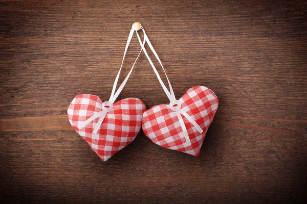 Two hearts and wooden background. — Stock Photo, Image