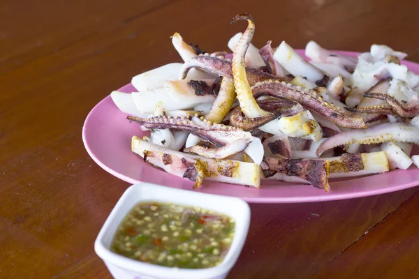 Grilled Squid on disc wood table — Stock Photo, Image