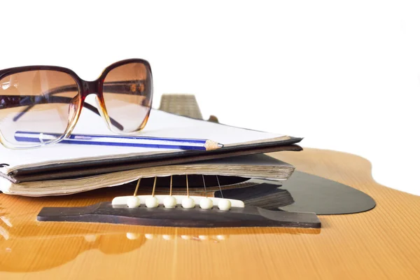 Close up guitar and pencil for create music select focus — Stock Photo, Image