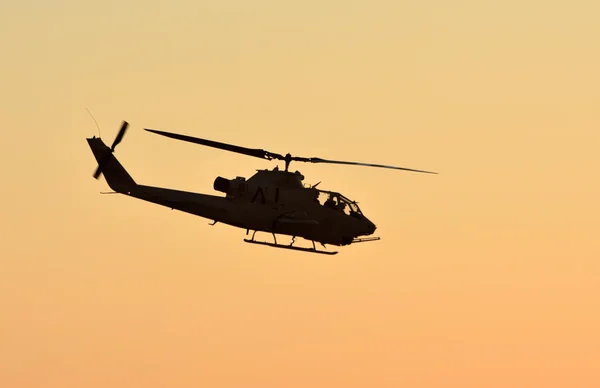 Military helicopter at sunset — Stock Photo, Image
