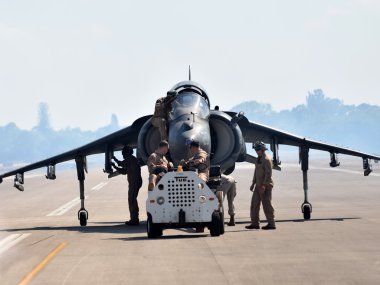 Crews retrieve Harrier fighter jet clipart
