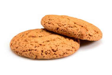 Ev yapımı kurabiyeler. Yulaf unundan yapılmış iki tatlı kurabiye. Beyaz arka planda izole edilmiş yüksek çözünürlüklü yakın çekim lezzetli bisküvi. Ev yapımı fırın..