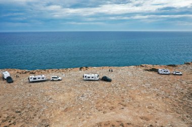 Camp with caravan on the edge of the cliffs on the semi arid country of the Nullarbor Plain clipart