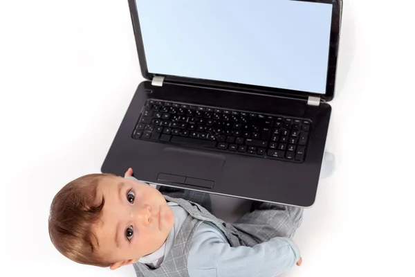 Baby and the notebook — Stock Photo, Image