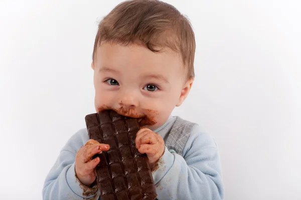 Baby eating chocolate — Stock Photo, Image