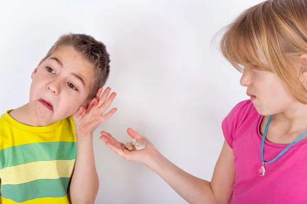 Boy cant hear, the solution is a hearing aid — Stock Photo, Image