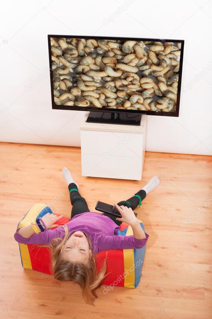 Kid with worms on TV