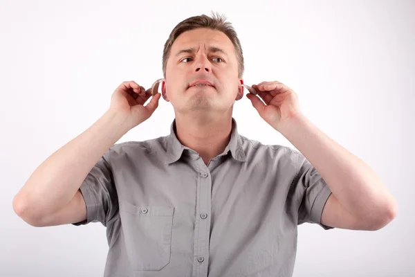 Man putting on hearing aids — Stock Photo, Image