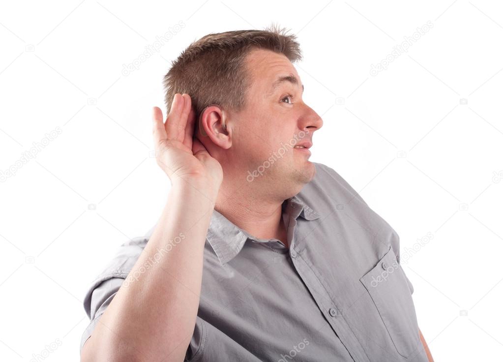 Middle-aged man wearing hearing aid