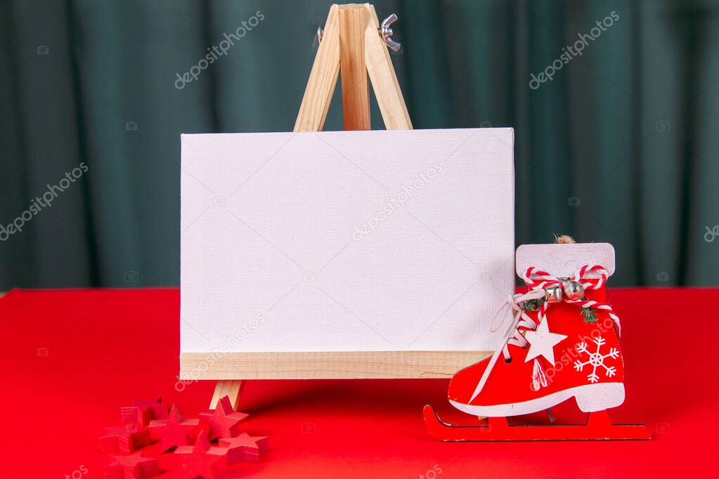 Photo of a wooden calendar on a red background, christmas, wooden toys, place for text