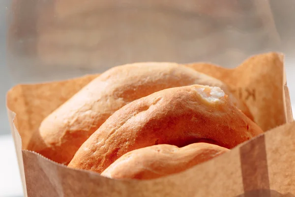Several armenian homemade bread mantakash in a paper bag. — Stock Photo, Image