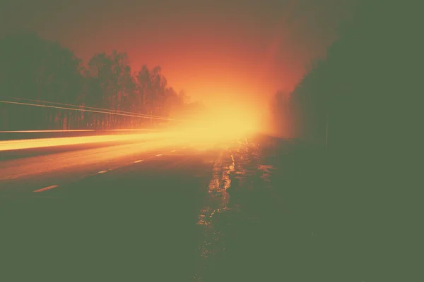 Car light trails in the road at night — Stock Photo, Image