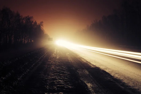 Car light trails in the road at night — Stock Photo, Image