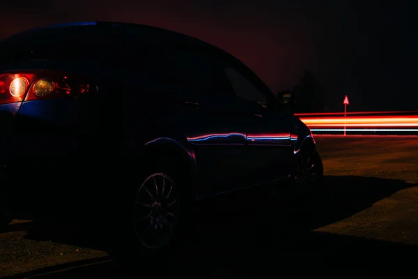 Car near the highway at night — Stock Photo, Image