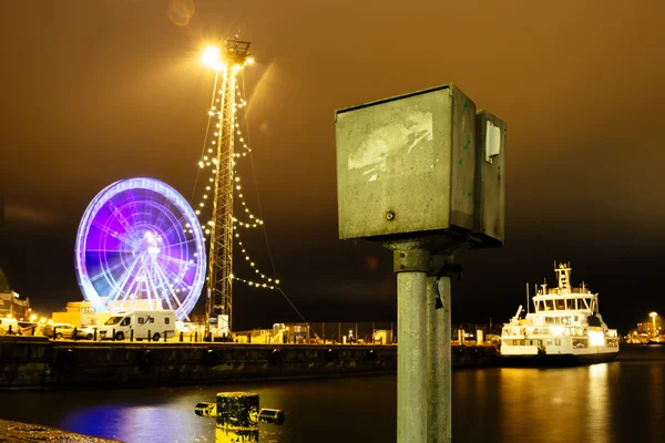 Ferris wheel at night in motion at the pier — Stock Photo, Image