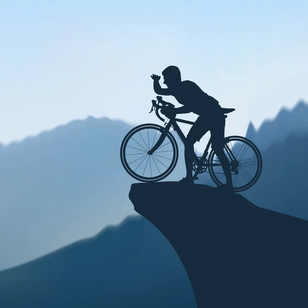 Cyclist in the mountains — Stock Vector