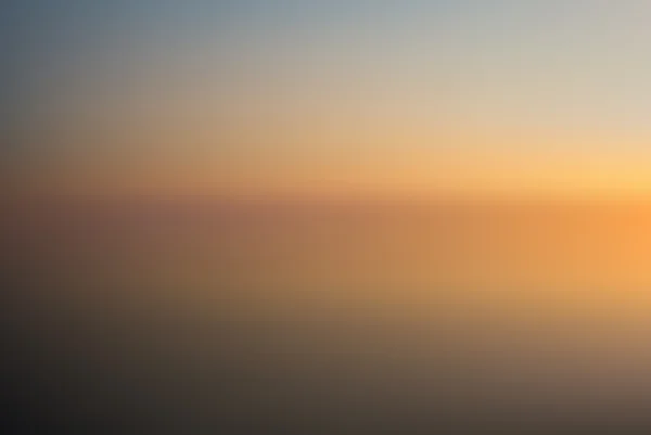 Plage au coucher du soleil fond flou — Image vectorielle