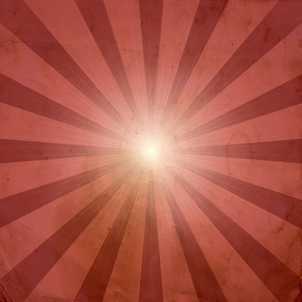 Grunge sunburst on old paper background — Stock Photo, Image