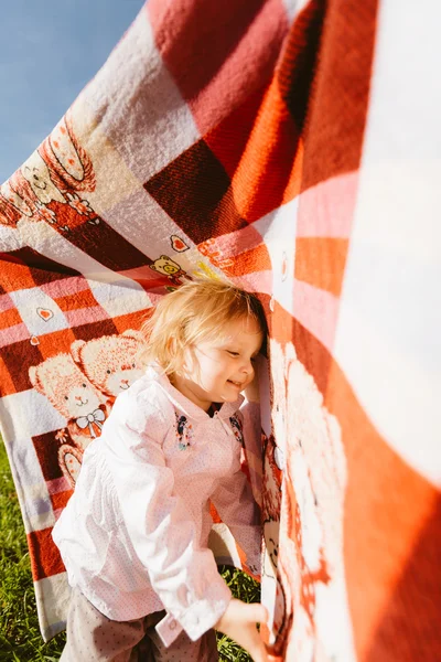 Little happy girl with blanket — Stock Photo, Image