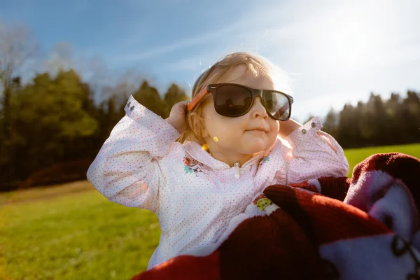 Little happy girl in sunglasses — Stock Photo, Image