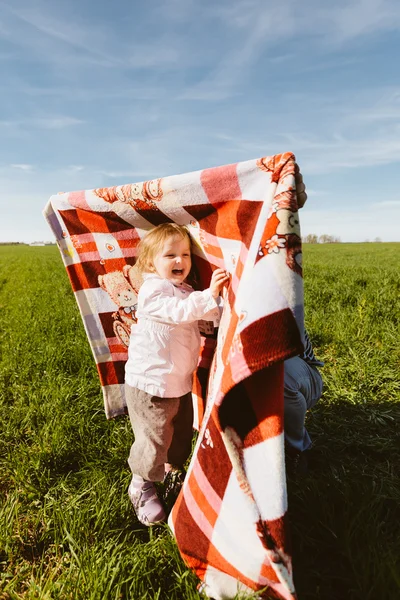 Little happy girl with blanket — Stock Photo, Image