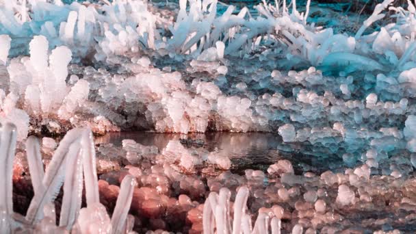 Unusual forms of rose quartz color ice. — Stock Video