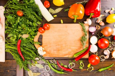 Wooden cutting board with assorted vegetables