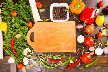 Wood Cutting Board with Fresh Herbs and Vegetables