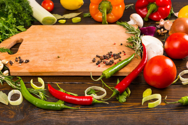 Assorted hot peppers and spices on table