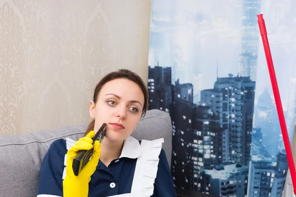 Thoughtful housekeeper in a high-rise apartment — Stock Photo, Image