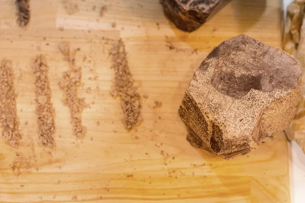 Chocolate block and lines of crumbs — Stock Photo, Image