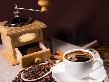 Freshly ground coffee in open wooden grinder