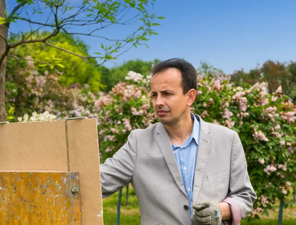 Portrait of a male painter in the process outdoors — Stock Photo, Image
