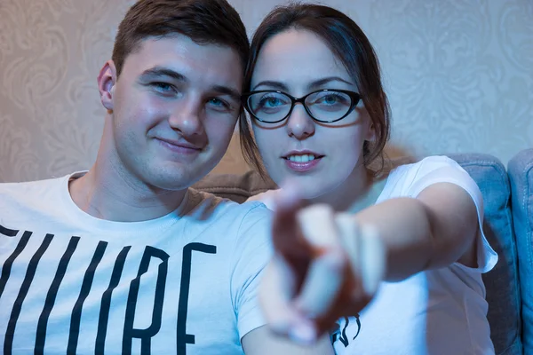 Young beautiful girl in glasses is pointing at the camera — Stock Photo, Image